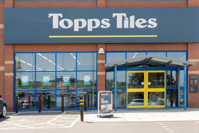 Topps Tiles has bounced back to profit after delivering a record year of revenue as the retailer unveiled plans to be “carbon balanced” by 2030.