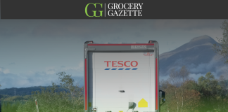 Tesco lorry driving on a road
