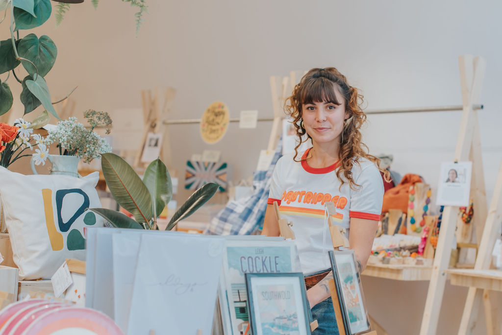 Tillie Peel sitting at a table in The Pop Up Club