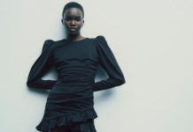 Model wears a little black dress made from captured carbon emissions