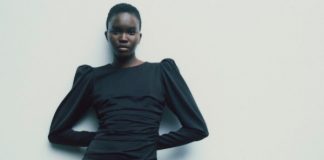 Model wears a little black dress made from captured carbon emissions