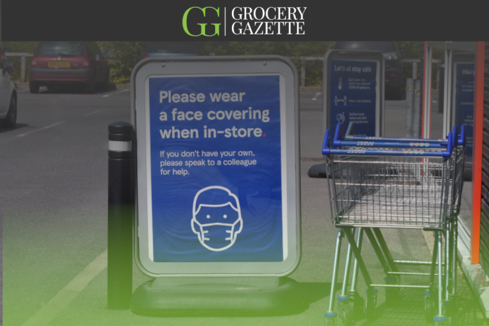 Sign outside Tesco asking customers to wear a fask mask