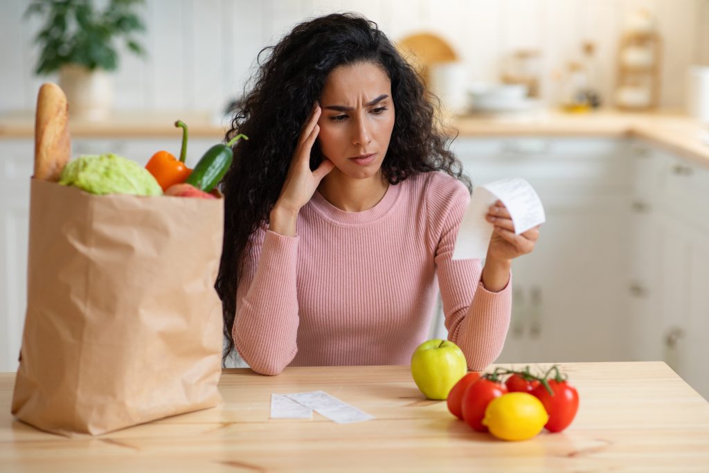 woman worrying about food price rises