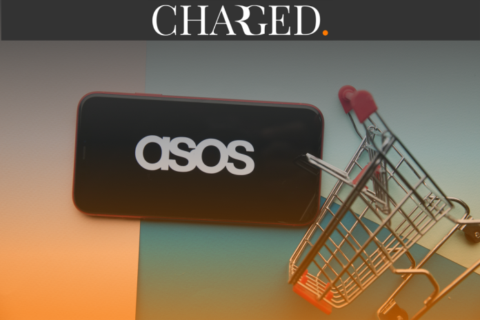 Asos logo on phone next to shopping trolley
