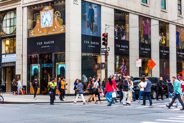 Ted Baker has posted a rise in sales ahead of its US takeover, buoyed by high street recovery