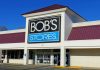 Frasers Group has sold Bob's Stores and Eastern Mountain Sports to US-based GoDigital Media Group for $70 million.