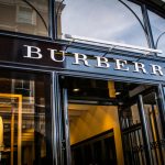 Burberry has posted a rise in full-year profit but warned that its outlook for future trading is dependent on its recovery in China.