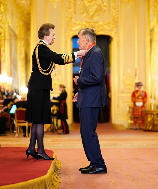 Specsavers co-founder and chairman Doug Perkins has been awarded a CBE at an investiture ceremony held at Windsor Castle.