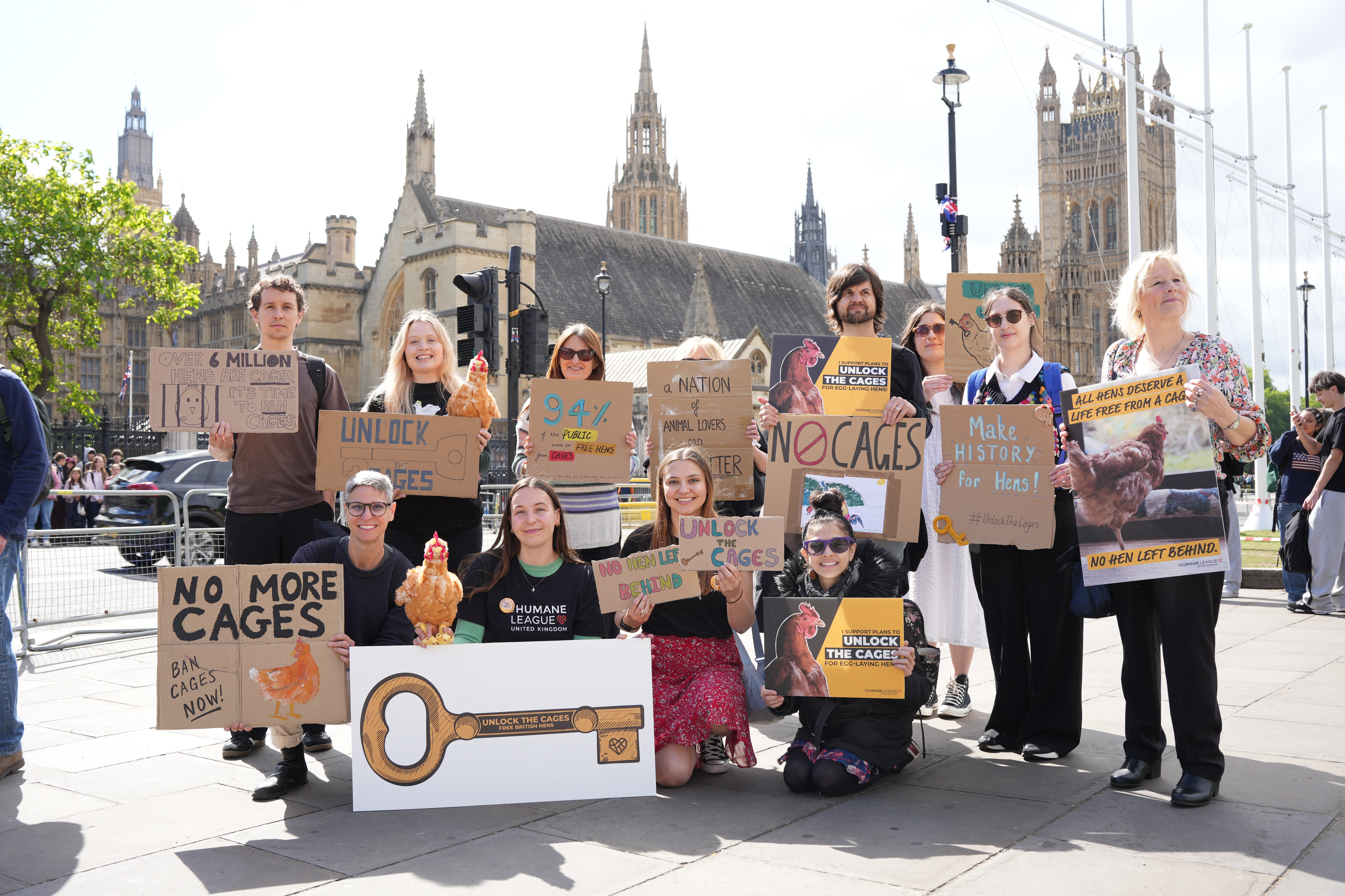 Animal welfare campaigners staged a protest in Parliament Square on Tuesday, urging the Government to ban cages for laying hens.