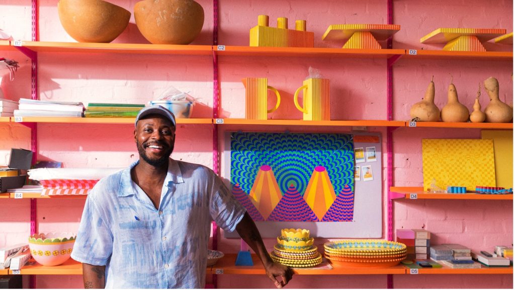 Stepping into Tomorrowland's installation, you are immediately hit with the rich blues, greens, oranges and pinks layered that have now become synonymous with Yinka Ilori's work, makes Absolut's new Tomorrowland installation a refreshing pop of colour.