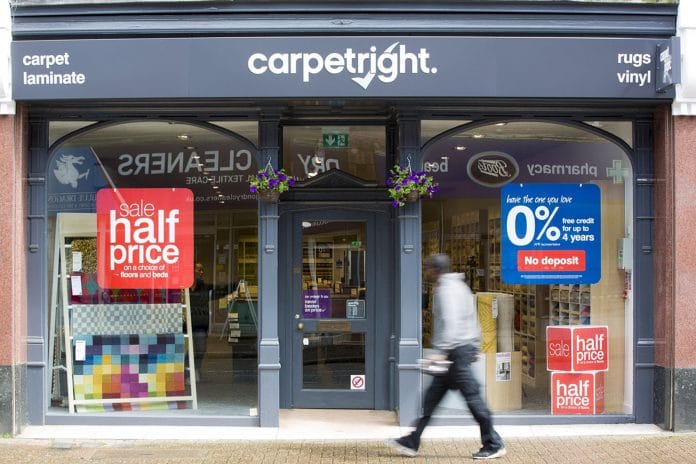 Carpetright profit warning