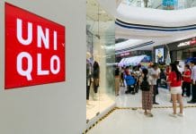 Uniqlo owner Fast Retailing has lowered its annual profit forecast as a result of additional Covid-related government restrictions in Japan and overseas denting footfall.